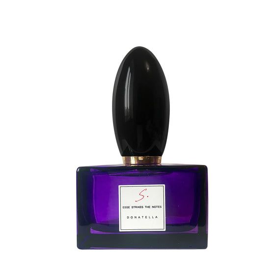 Donatella - The Scent Room  Eau de Parfum   Top Notes: Iris, Violet, Bergamot, Rose Middle Notes: Patchouli, Myrrh, Pink Pepper, Incense Base Notes: White Musk, Ambergris, Vanilla